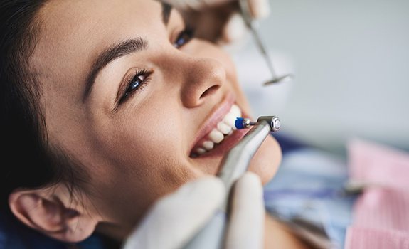 a patient undergoing a dental cleaning in Lakewood