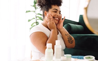 person smiling and relaxing in their living room