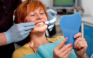 woman visiting dentist for denture consultation