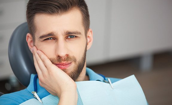 Man visiting emergency dentist in Lakewood, Dallas for a toothache