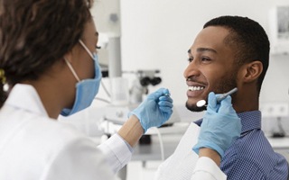 man at a checkup with his dentist