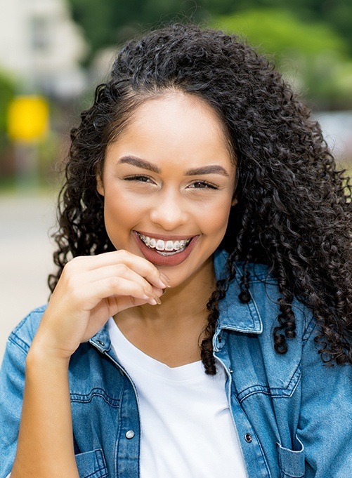 Young woman with tooth colored braces