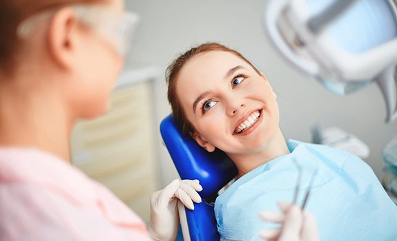 Patient listening to dentist in Lakewood 