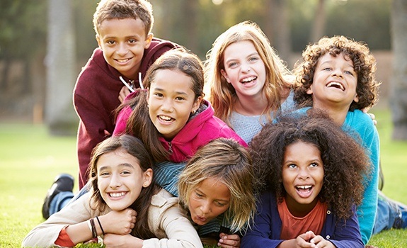 Group of kids laughing together after children's dentistry