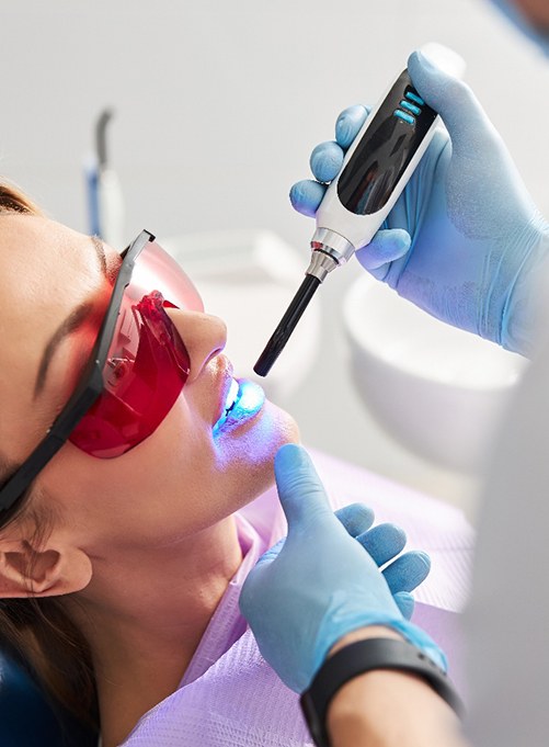 an adult patient receiving a dental sealant