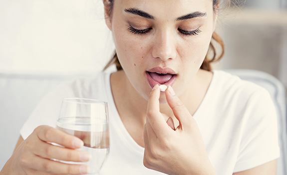 Patient taking oral conscious sedation dentistry pill