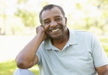 Man with healthy smile after periodontal therapy