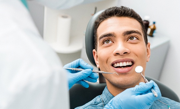 man getting dental checkup in Dallas