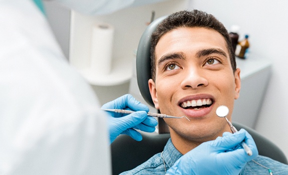 man getting dental checkup in Dallas