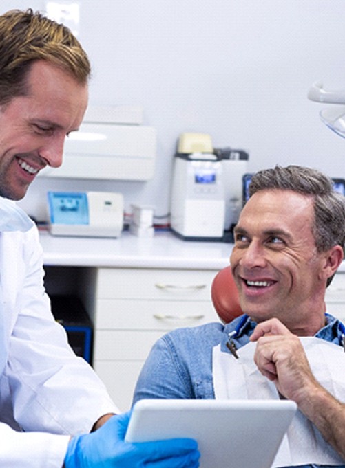 Man smiling at the dentist in Dallas