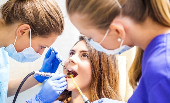 Woman getting a tooth-colored filling in Dallas