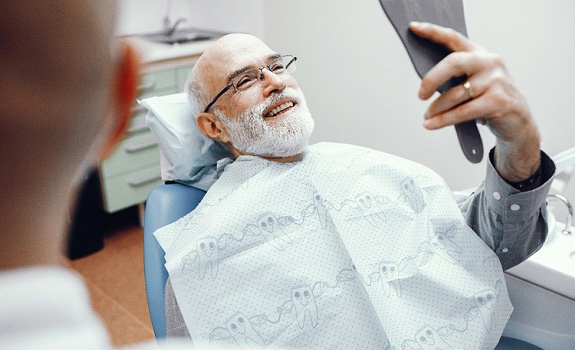 Man smiling after getting a dental crown in Dallas