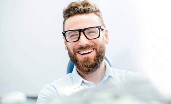 patient smiling after teeth whitening in Dallas