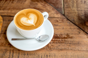 Coffee mug with heart-shaped latte art